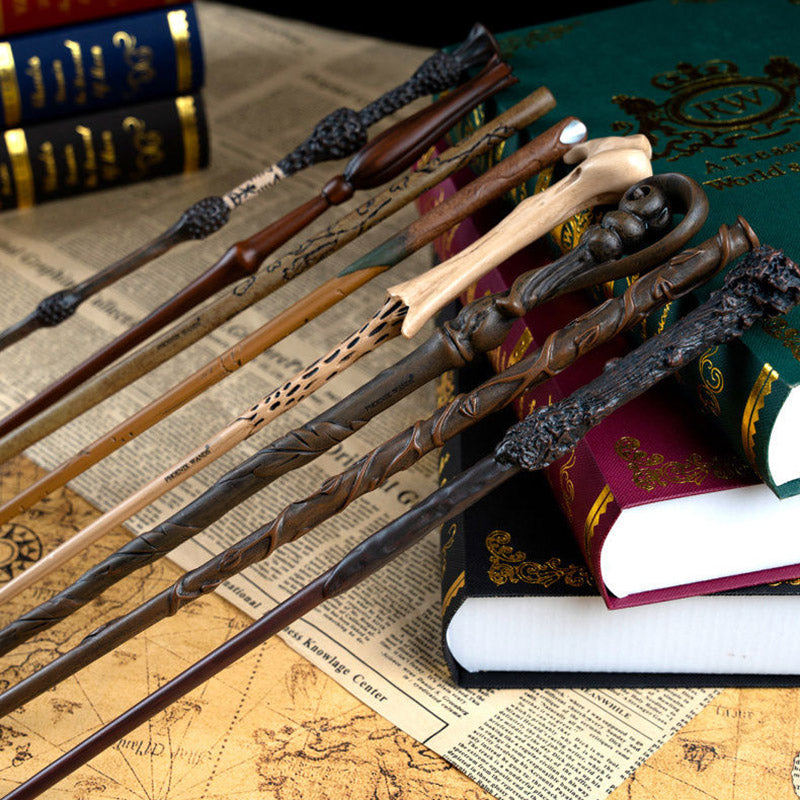 Harry Potter wands displayed on vintage books and a map, showcasing intricate designs for wizard fans and collectors