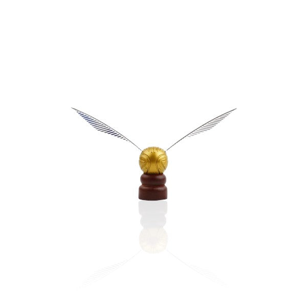 Golden Snitch replica from Harry Potter, featuring detailed wings and displayed on a wooden stand against a white background